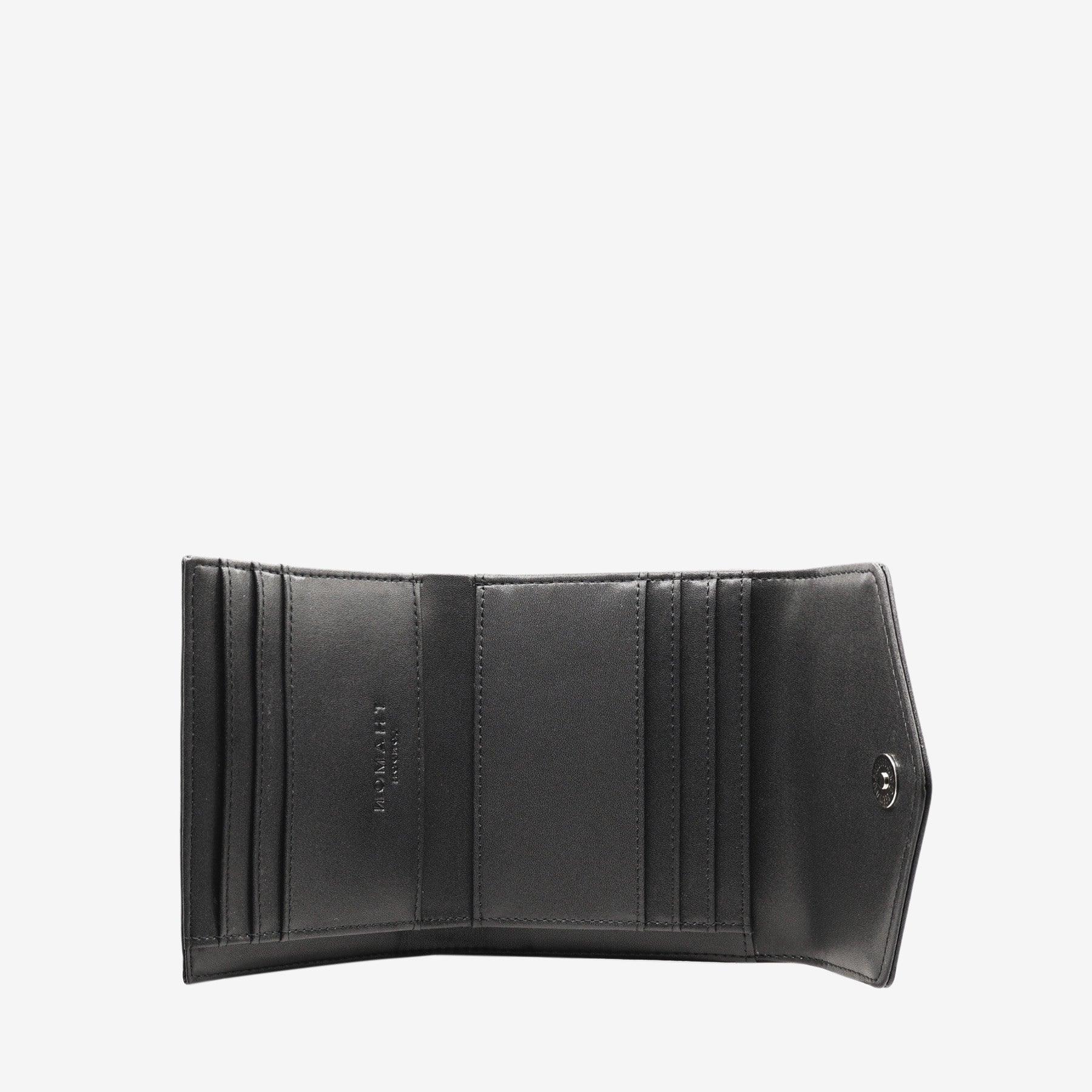 Close-up view of the inside of the Milly Compact Wallet in black leaf leather by Thamon, highlighting the quality craftsmanship and Thamon logo.