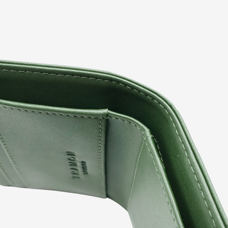 Detailed view of the cash compartment in the Milly Compact Wallet in forest green by Thamon, showcasing the spacious and well-crafted design