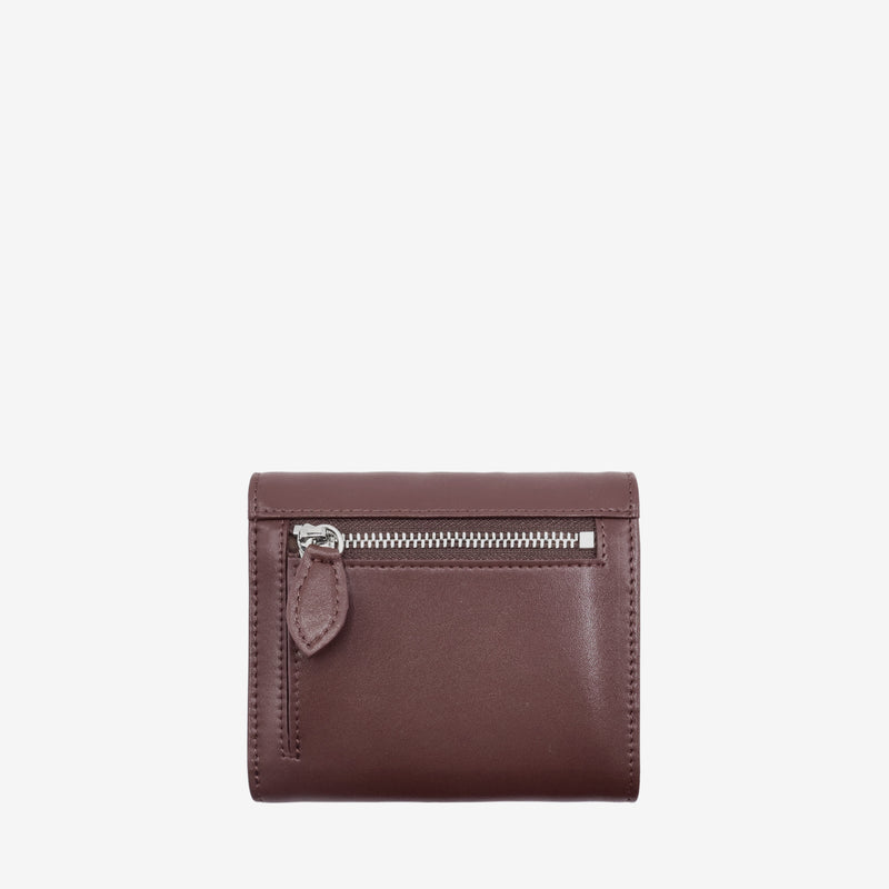 Back view of the Milly Compact Wallet in spice brown leaf leather by Thamon, showcasing the zipper pocket and sleek design.