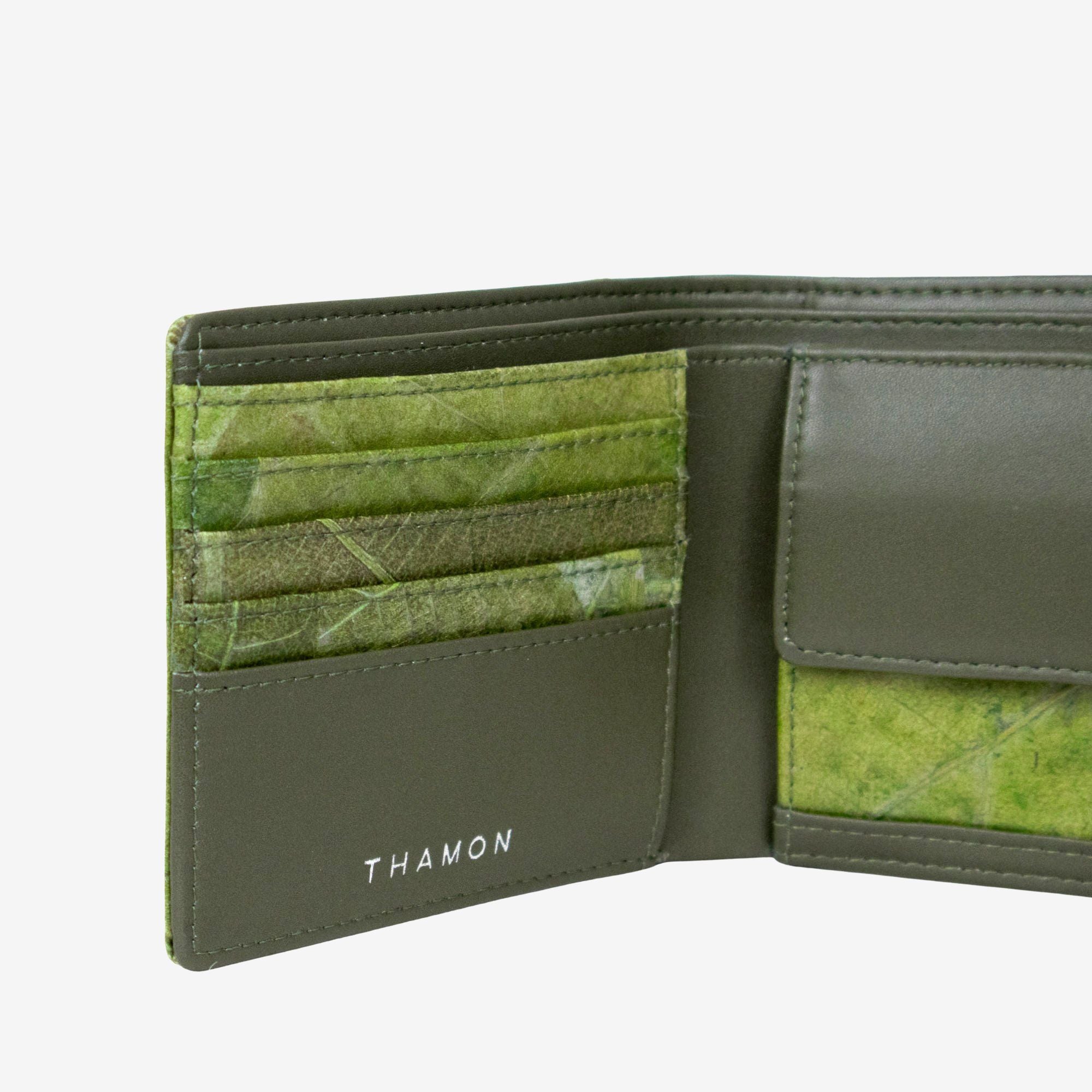 Close-up detail of Thamon men’s coin wallet in olive leaf leather showing natural leaf texture