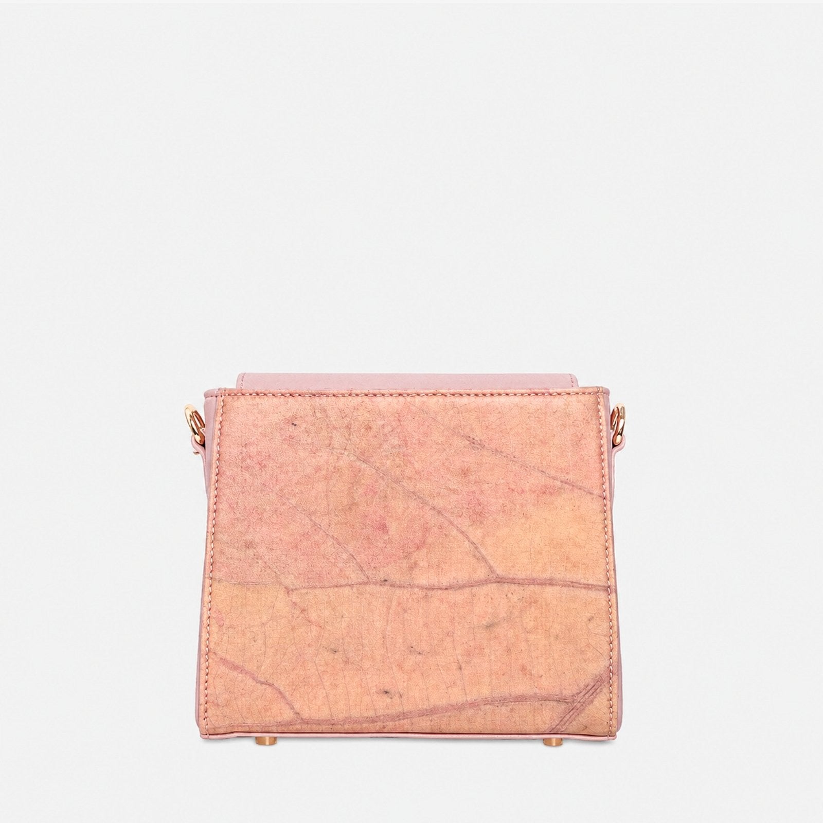 Back view of the Pearl Crossbody Bag in Blossom Pink with natural Leaftex texture