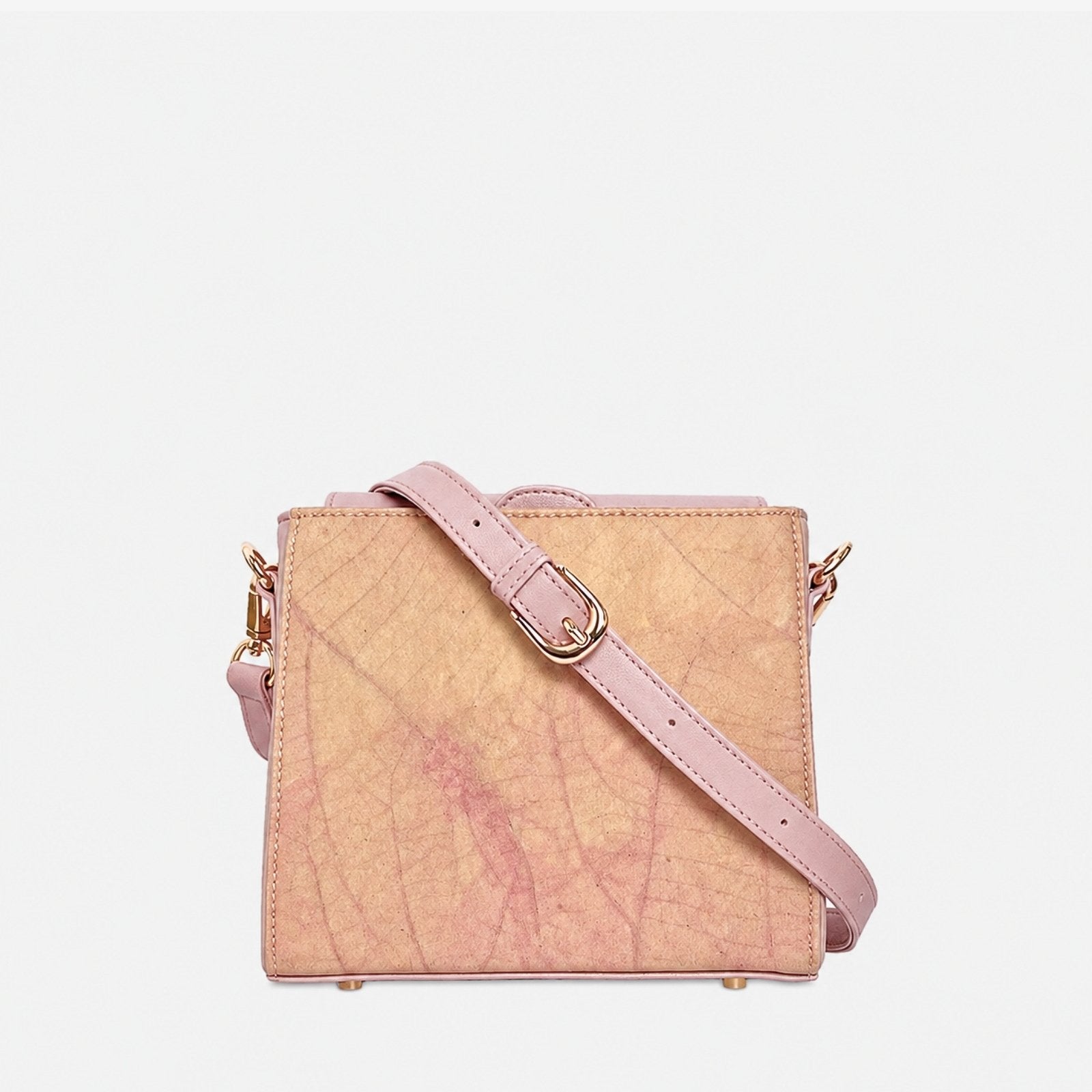 Front view of the Pearl Crossbody Bag in Blossom Pink with natural Leaftex texture