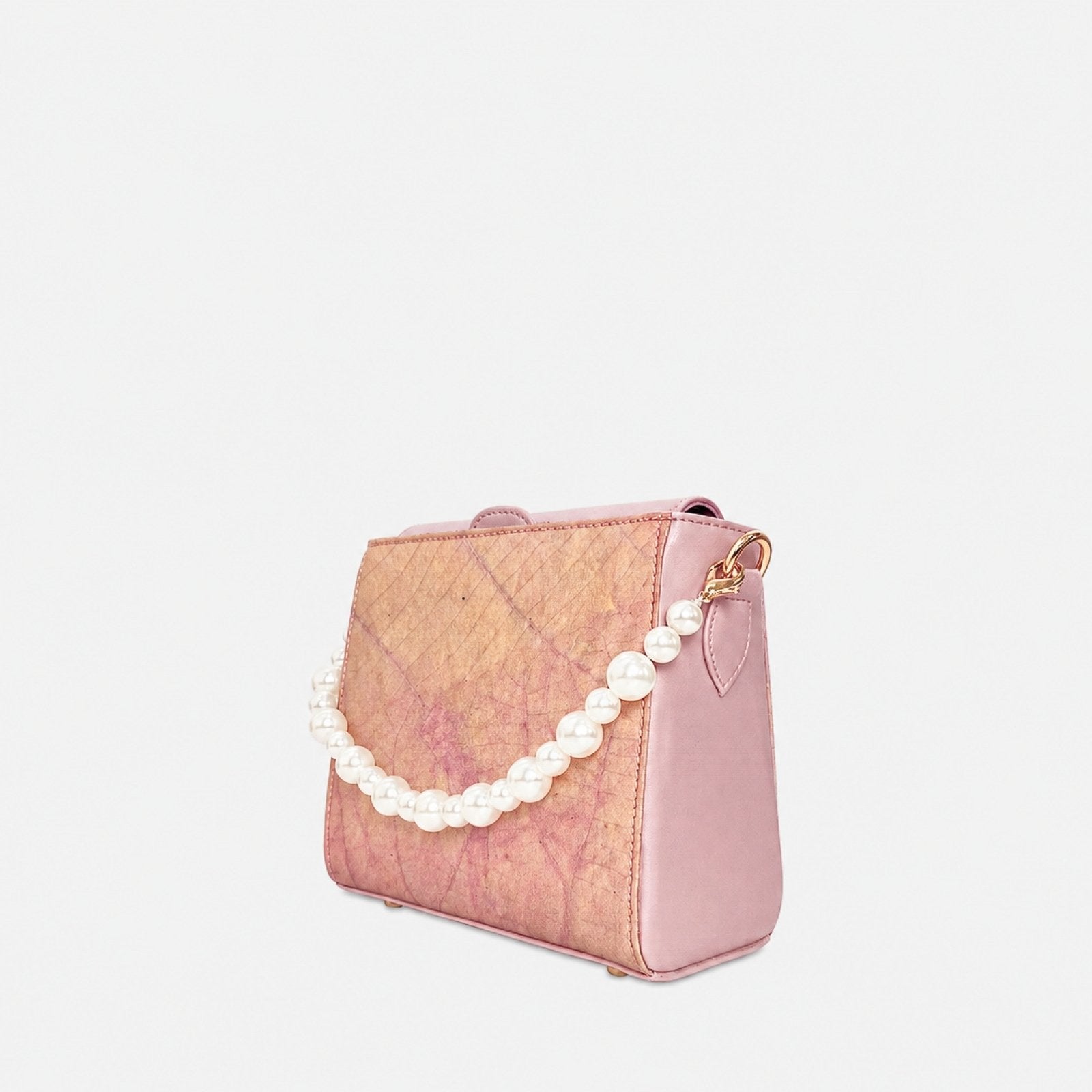 Side view of the Pearl Crossbody Bag in Blossom Pink with Leaftex detailing