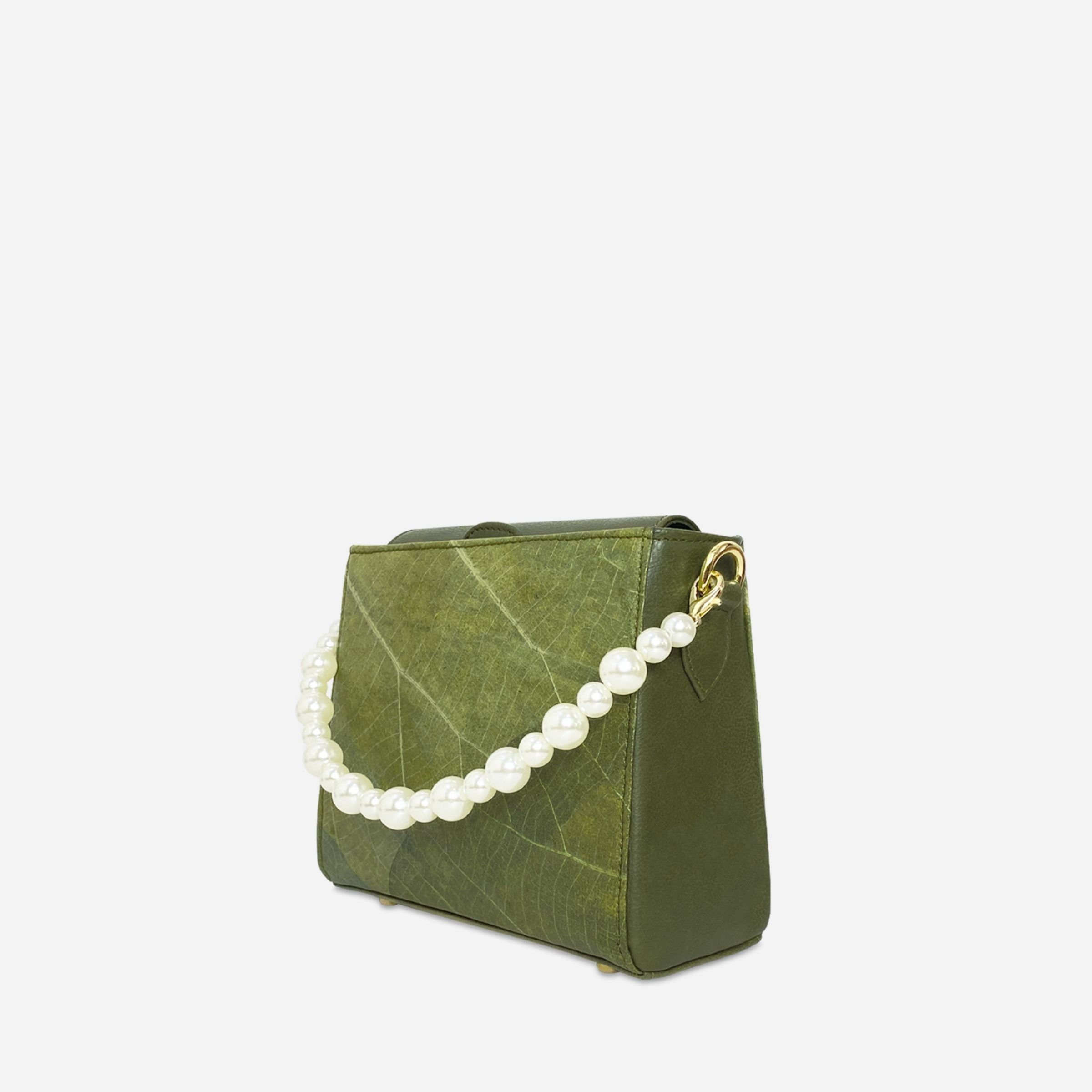 Side angle of Pearl bag in olive green leaf leather with decorative pearl handle