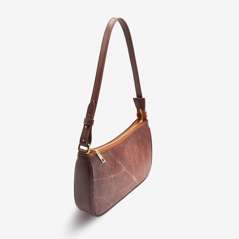 Side view of the Mila Spice Brown Vegan Shoulder Bag showcasing the zipper closure and elegant leaf leather texture