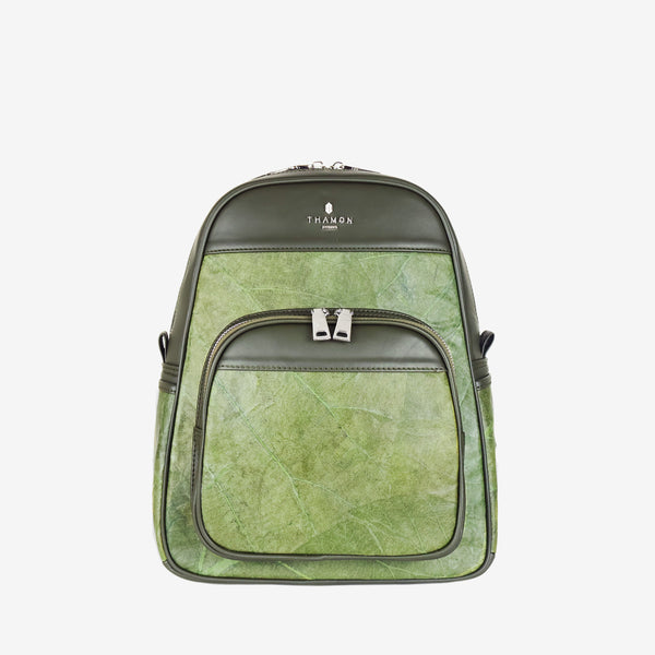 Front of Thamon Foglia backpack, crafted from eco-friendly leaf leather. The backpack has an olive green color, with visible leaf veins that give it a natural and textured appearance. The front features a zip pocket with silver-tone dual zippers, and the top section has the Thamon logo subtly embossed in silver. 