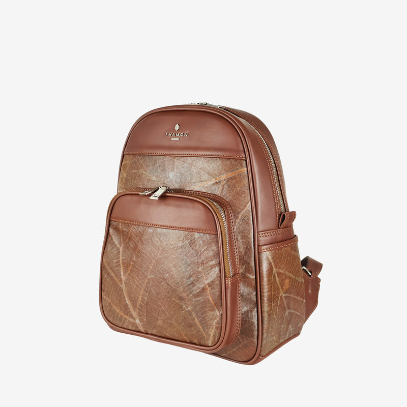 Side view of Thamon Foglia backpack in spice brown, made from natural leaf patterns and vegan leather.