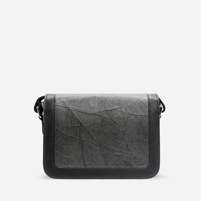 Back view of Molly Crossbody Bag in Black Vegan Leather by Thamon, showcasing the intricate leaf texture design.