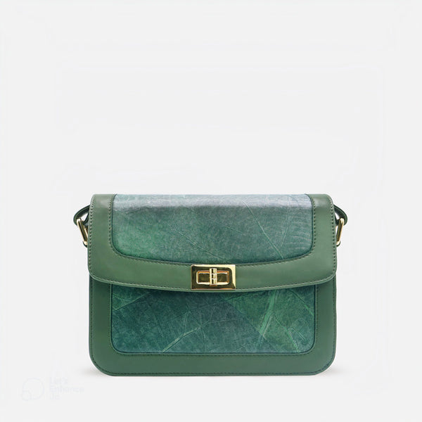 Front view of the Forest Green Molly Vegan Leather Bag by Thamon, featuring a leaf pattern design and twist-lock closure.