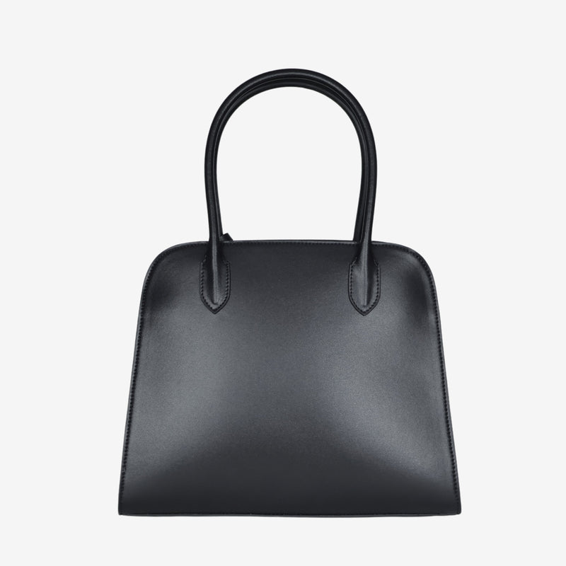 Back view of the Sloane tote bag in black vegan leather, featuring a smooth, minimalist surface with clean stitching and sturdy top handles.