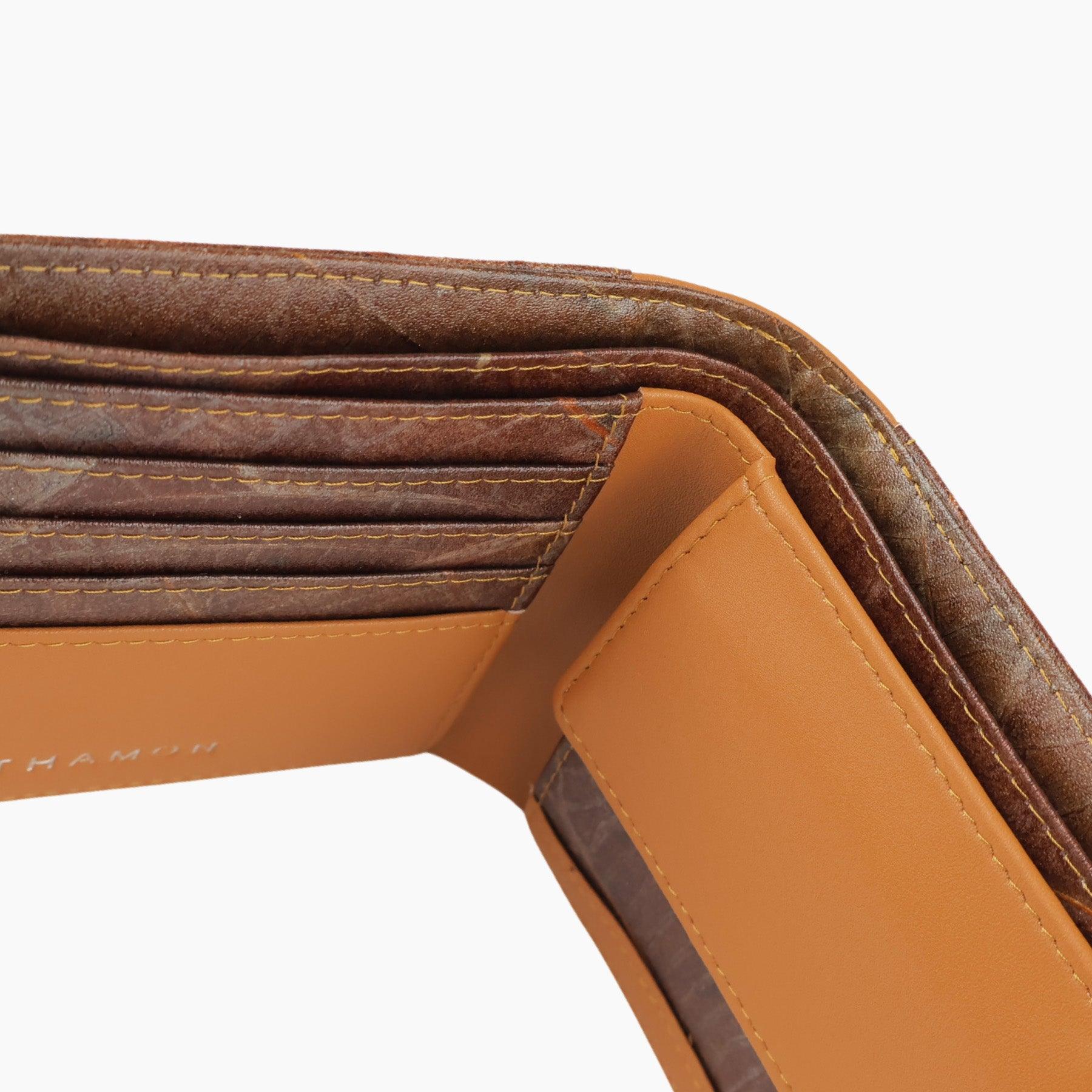 Top view of the Timber Tan Vegan Leather Coin Wallet by Thamon showing the detailed stitching, material quality, the cash and coin compartment and card slots with a leaf leather finish.