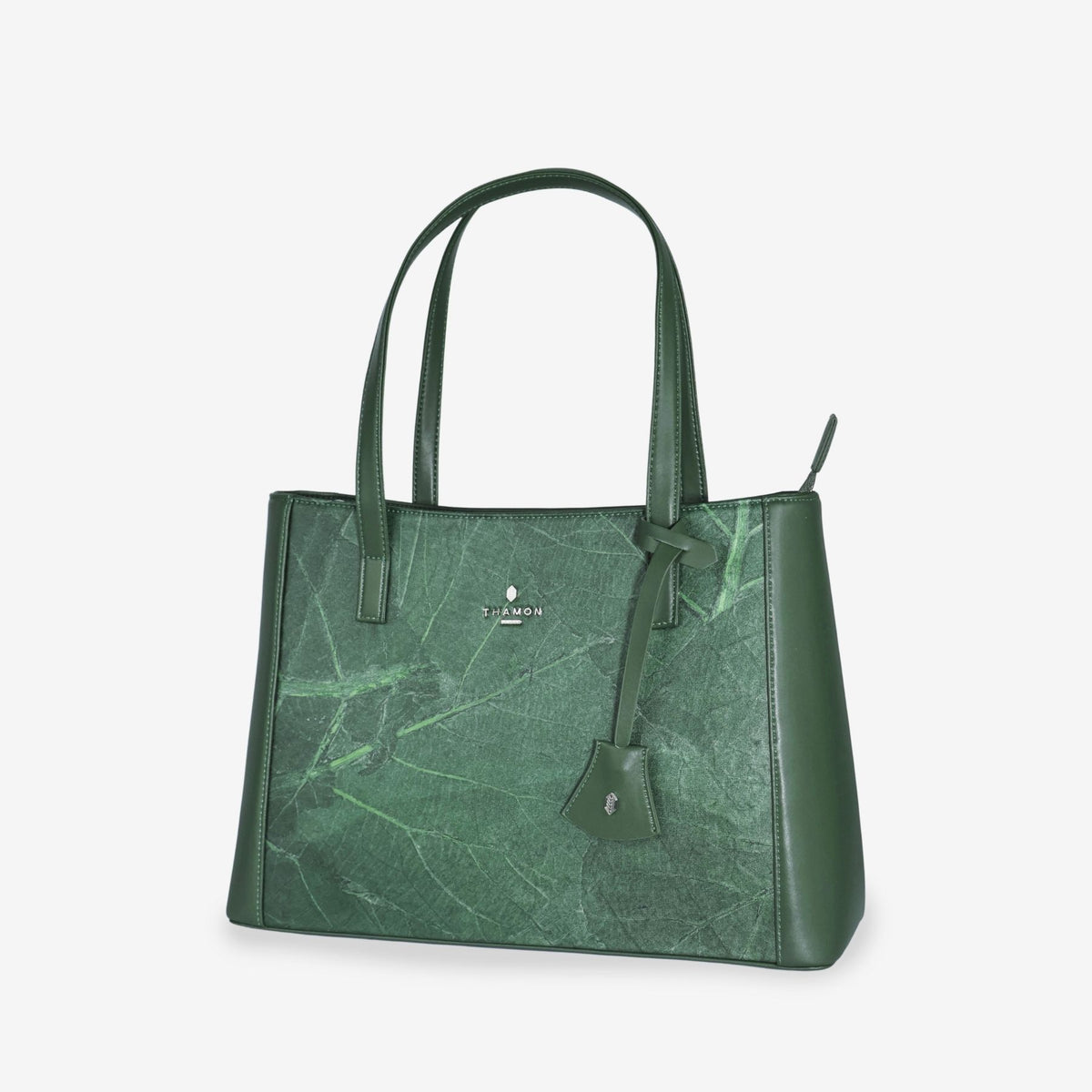 Side view of tote bag in forest green made from leaf leather