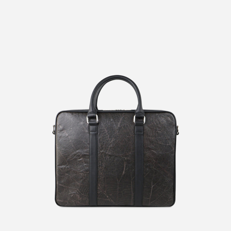 A back viewed of the Black leaf leather Cambridge briefcase by Thamon with leaf vein texture and twin handles, against a white background.