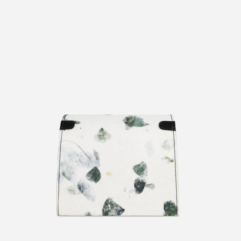 Back view of the Thamon camouflage leaf box bag, displaying a white base with a unique green leaf pattern and black corners, highlighting the bag’s eco-friendly design and attention to detail.