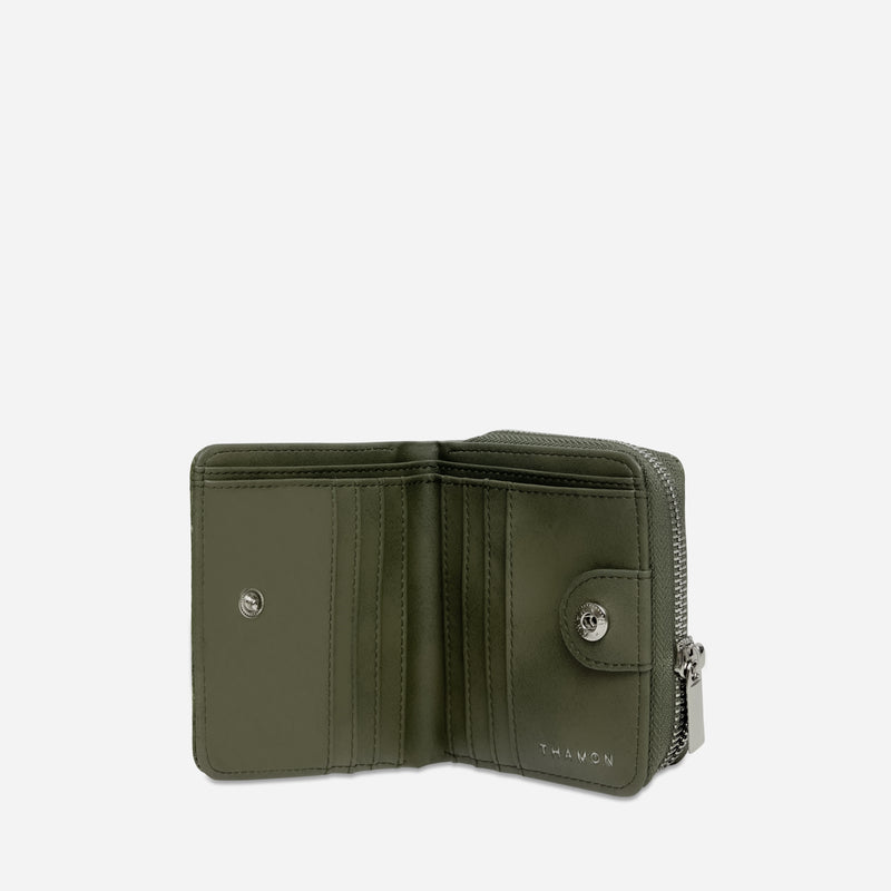 Interior view of a Thamon compact vegan zip wallet in camouflage, showcasing two cash compartments, multiple card slots, and a zippered coin section, all made with cruelty-free materials.