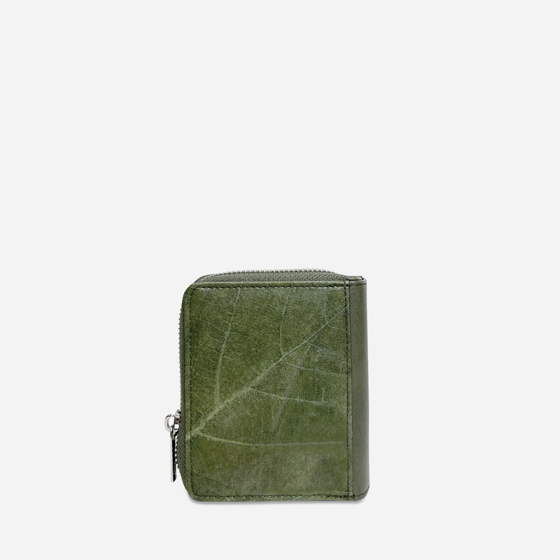 Back view of a Thamon forest green leaf leather compact zip-around wallet with detailed leaf vein texture.