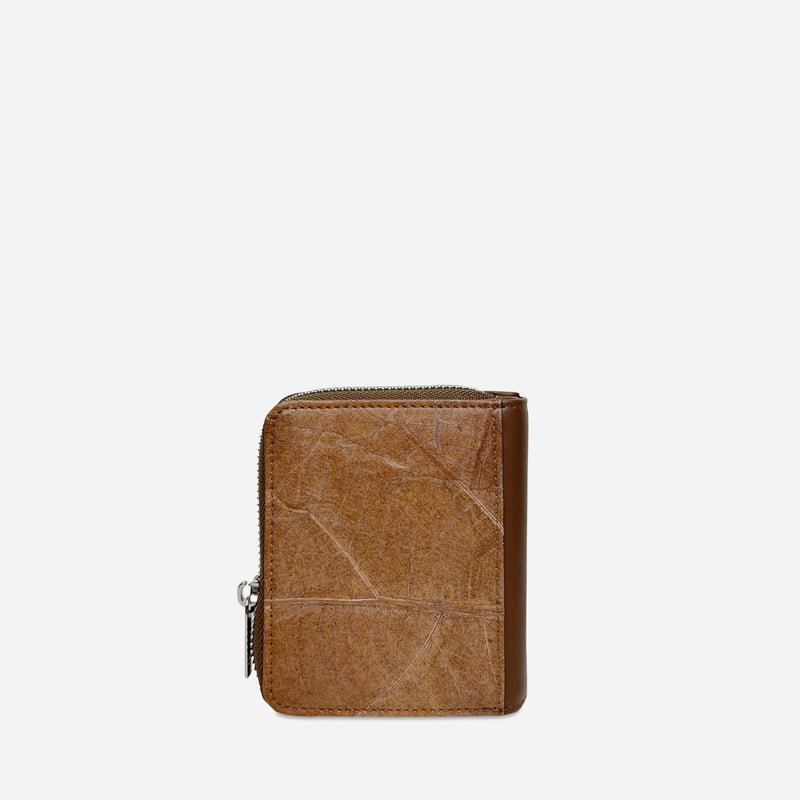 Back view of a Thamon spice brown leaf leather compact zip-around wallet with natural leaf vein texture.