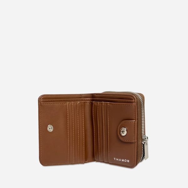 Open Thamon spice brown leaf leather wallet, revealing two cash sections, card slots, and embossed branding.